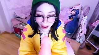 A cosplay girl, inspired by Valorant’s vibrant style, enjoys solo play with toys