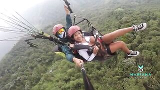 A sexy woman squirts while flying a parachute over the sea with Mariana Martix