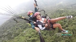 A sexy woman squirts while flying a parachute over the sea with Mariana Martix