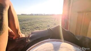A couple having fun in their camper on the road with the door open