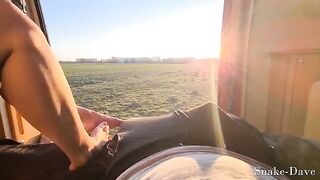 A couple having fun in their camper on the road with the door open