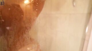 A young beauty has sex with a huge dildo in the shower