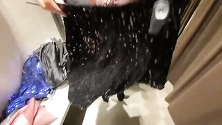 A hot girl is trying on clothes in the changing room and gets fucked
