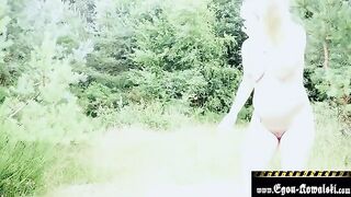 A pregnant blonde is getting fucked on the beach