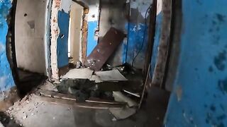 An exhibitionist girl walks through abandoned buildings, getting intimate in risky spots