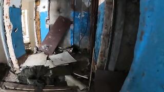 An exhibitionist girl walks through abandoned buildings, getting intimate in risky spots