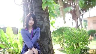 A sunny day in the garden with an Asian beauty and her toys