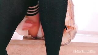 A schoolgirl without panties masturbates passionately in a provocative pose