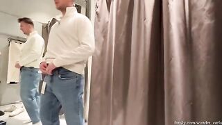 A couple has a great time shopping and almost gets caught in the fitting room