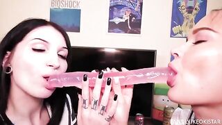 Two lesbian beauties play with their nice pussy with dildo