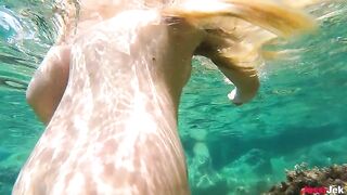 Babe has sex with boyfriend in the water on the beach