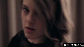 The beautiful woman plays with her big natural tits and pours milk on them
