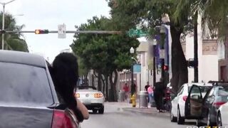 A young guy has fun with two girls in the car