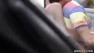 A young guy has fun with two girls in the car