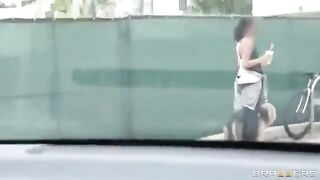 A young guy has fun with two girls in the car