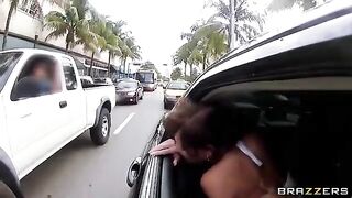 A young guy has fun with two girls in the car