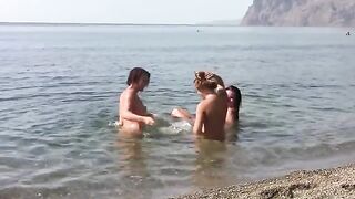 Three girls with shaved pussy posing naked on the beach