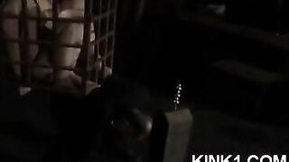 A slave in a cage executes all the orders of the master