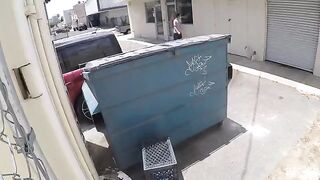 The girl was photographed having sex behind the garbage bin