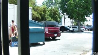 The girl was photographed having sex behind the garbage bin