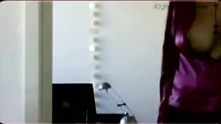 You can see something through her big boobs