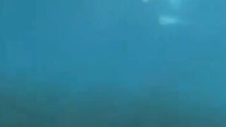 Two aqua analysts are having fun at the bottom of the sea