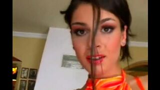 The pretty woman masturbates in a leather chair and achieves orgasm