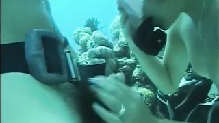 A man has sex with a woman with a hairy crotch underwater