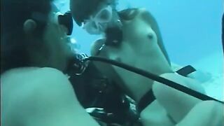 A man has sex with a woman with a hairy crotch underwater