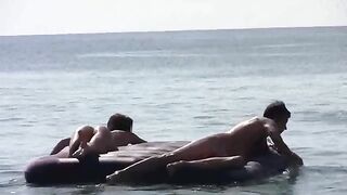 Nude beauties have fun on the beach without any clothes