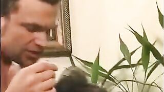 A 40-year-old guy playfully squeezing the boobs of two girls