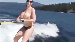 Topless girl skiing on the water, it was a great sight