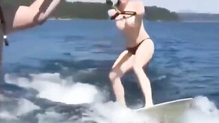 Topless girl skiing on the water, it was a great sight