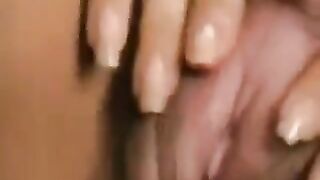 Hairy pussy with a large clitoris plays with itself