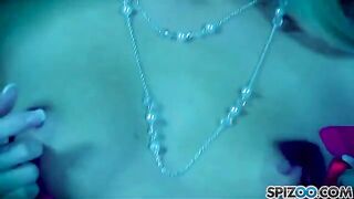 A blonde girl masturbating with a dildo to achieve orgasm