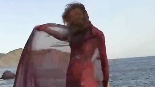 A girl with small boobs gets them wet while walking naked outdoors