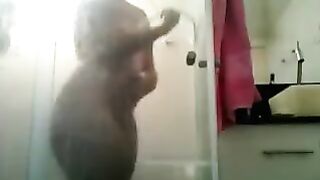 The huge ass franchisee barely fit in the frame of the shower