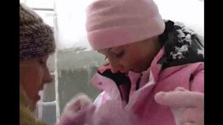 Two lesbians have fun on a cold winter day
