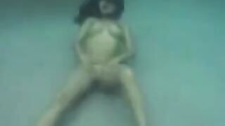Busty brunette beauty enjoys underwater sex in ocean