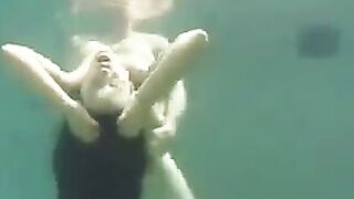 Busty brunette beauty enjoys underwater sex in ocean
