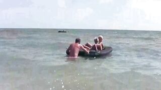 A naked girl is having fun on the mattress with someone