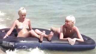 A naked girl is having fun on the mattress with someone