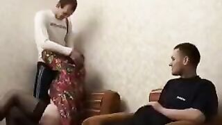A mature woman fucks her son's friend, exploring passionate desires