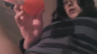A girl caresses her clitoris with a vibrator on the bed in HD