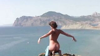 A girl poses naked on the beach to attract someone