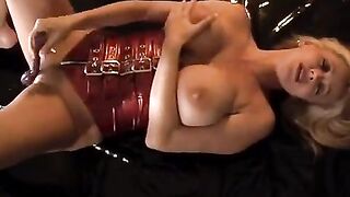 Rachel Aziani, with huge boobs, plays with her pussy using a toy