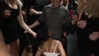 A mature woman with big tits is being fucked by several men
