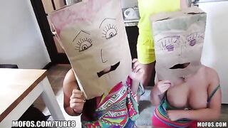 The girls wore bags on their heads and fucked with guys in an orgy