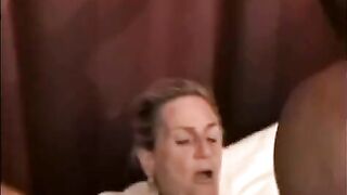 A black guy has sex with a mature woman