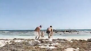 Bikini girls are having fun with guys on the beach